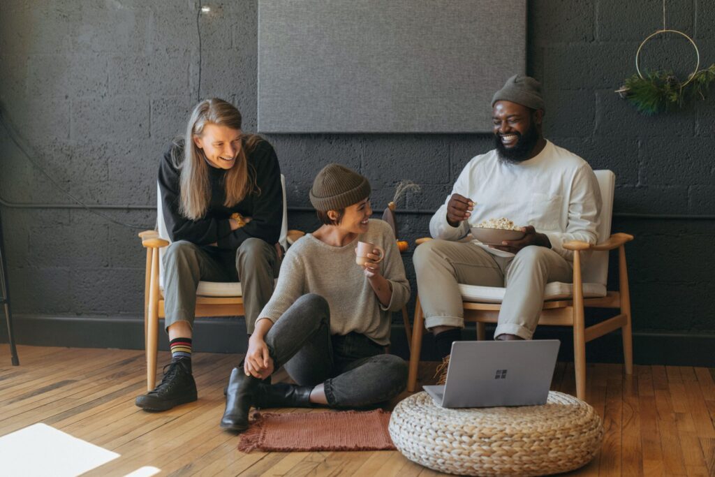 3 friends laughing while on a break