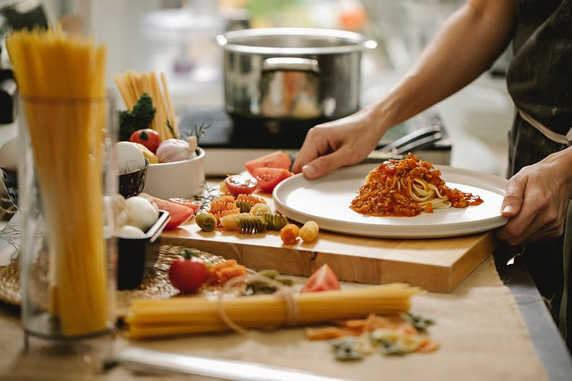 person cooking dinner